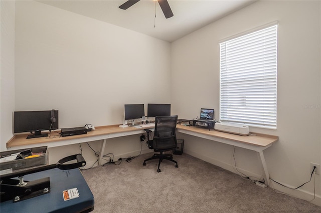 home office featuring ceiling fan and light colored carpet