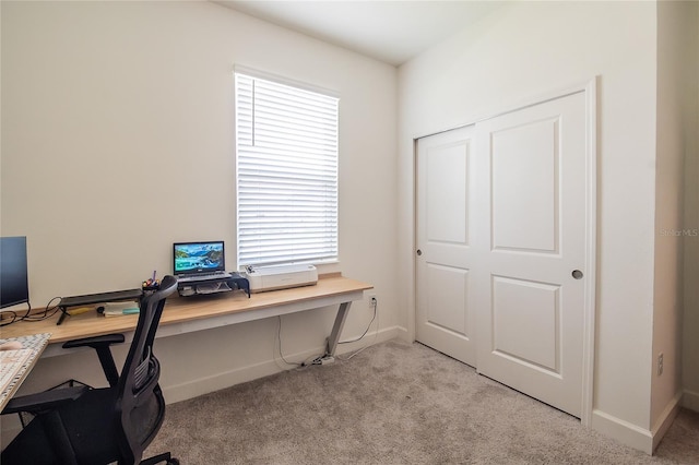 carpeted home office featuring a wealth of natural light