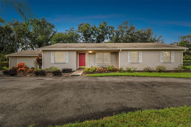 ranch-style home with a garage