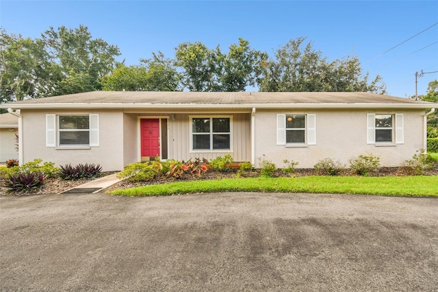 ranch-style home with stucco siding