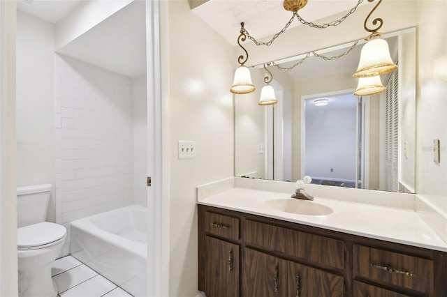 bathroom featuring toilet, tile patterned flooring, and vanity