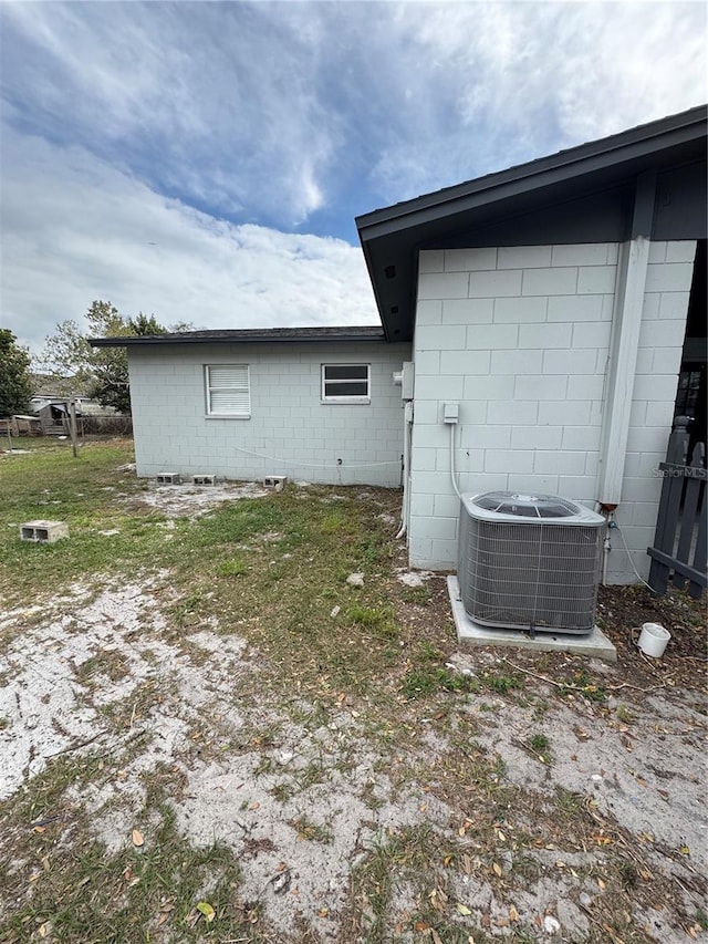 602 Taylor Blvd, Winter Haven, FL 33880 - view of side of property with central air condition unit and concrete block siding