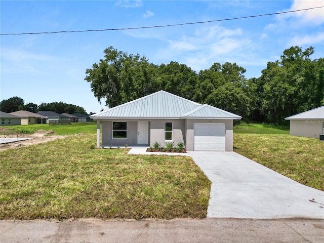 view of front facade with a front lawn and a garage