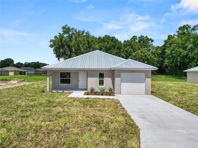 view of front of property with a front lawn and a garage