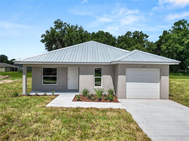 ranch-style home featuring a garage and a front lawn