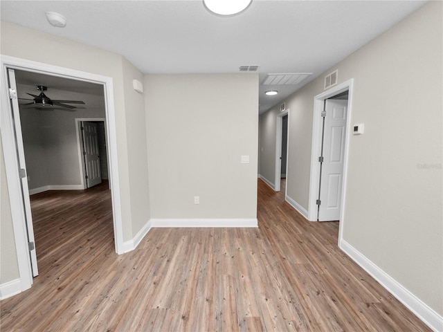 spare room with ceiling fan and hardwood / wood-style flooring