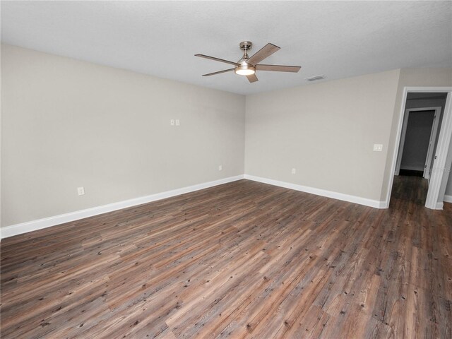 spare room featuring hardwood / wood-style floors and ceiling fan