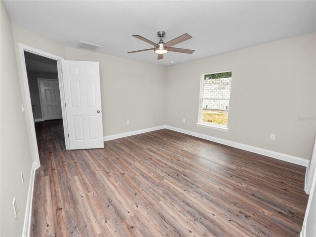 unfurnished room featuring hardwood / wood-style flooring and ceiling fan