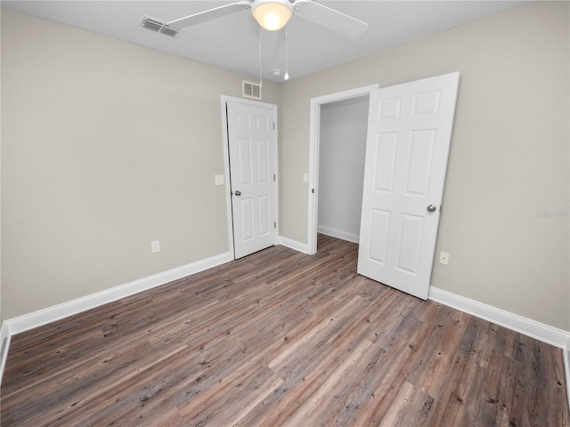 unfurnished bedroom with ceiling fan and hardwood / wood-style flooring