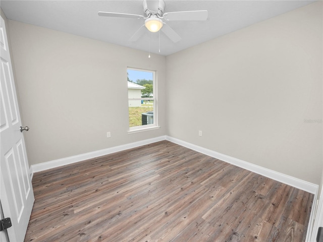 spare room with hardwood / wood-style flooring and ceiling fan