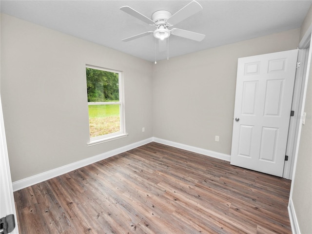 unfurnished room with ceiling fan and wood-type flooring