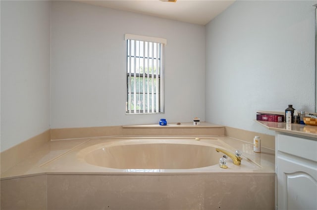 bathroom with vanity and a bathing tub