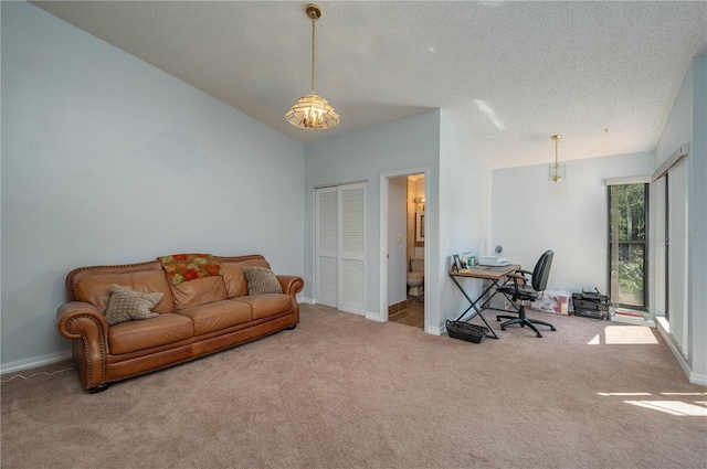 living room with light carpet and a textured ceiling