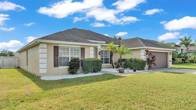 ranch-style home with a garage and a front lawn