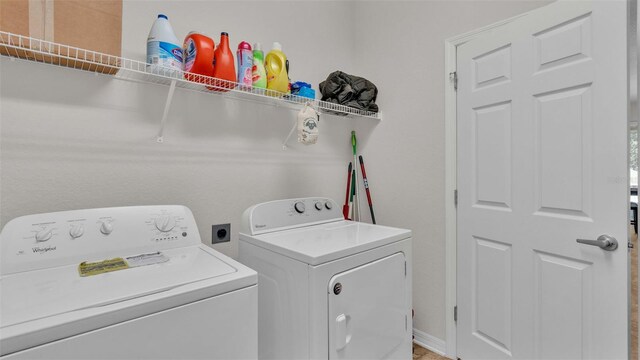 laundry room with independent washer and dryer