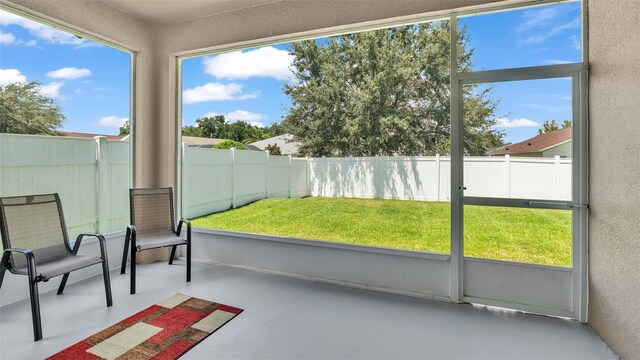 unfurnished sunroom with plenty of natural light