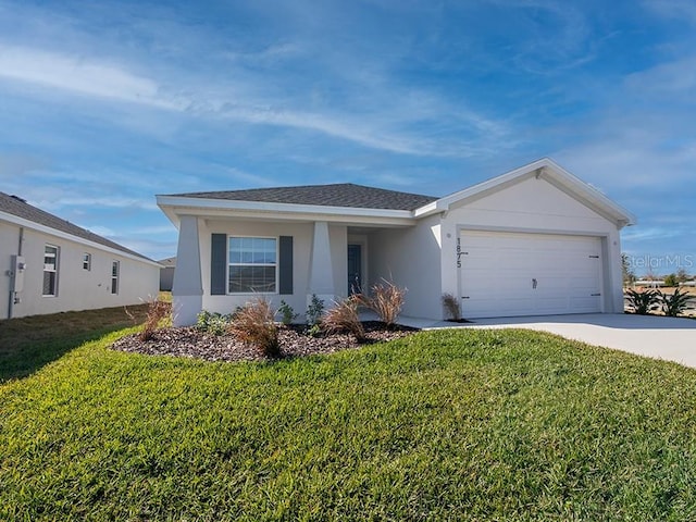 ranch-style house with a garage and a front lawn