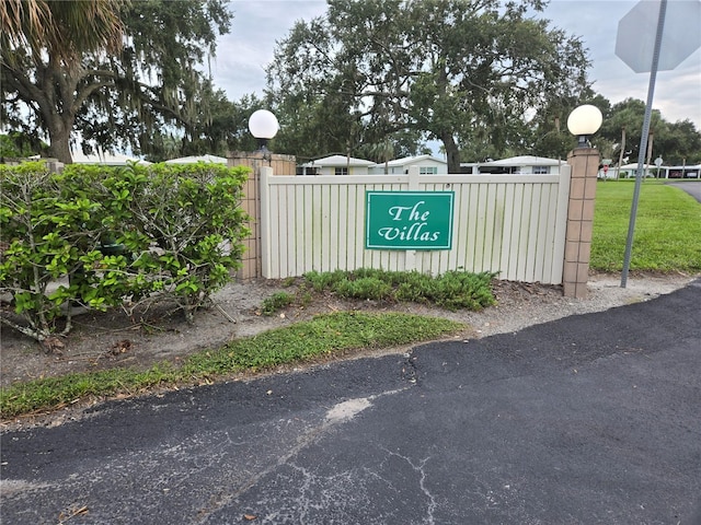 community sign with fence