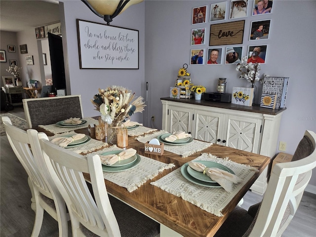 dining area with wood finished floors