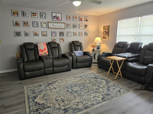 living room with ceiling fan, wood finished floors, and baseboards