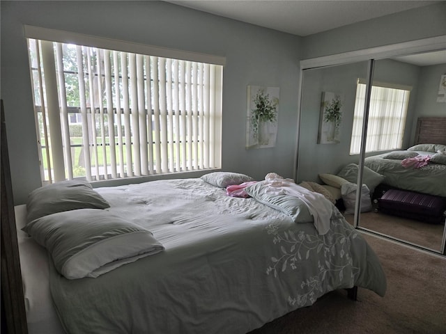 bedroom featuring a closet and carpet flooring