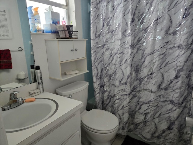 bathroom featuring vanity and toilet