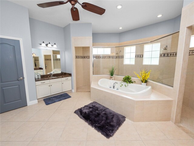 bathroom featuring tile patterned flooring, separate shower and tub, and plenty of natural light