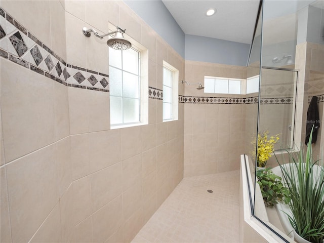 bathroom with tiled shower