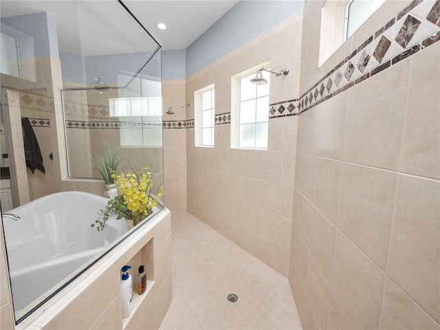 bathroom with separate shower and tub