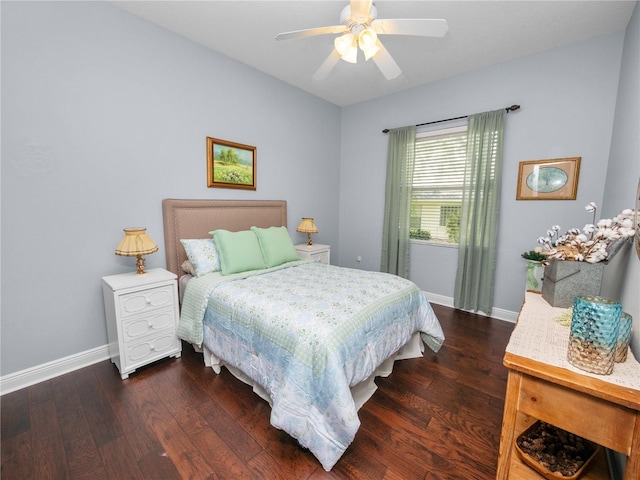 bedroom with ceiling fan and dark wood-type flooring