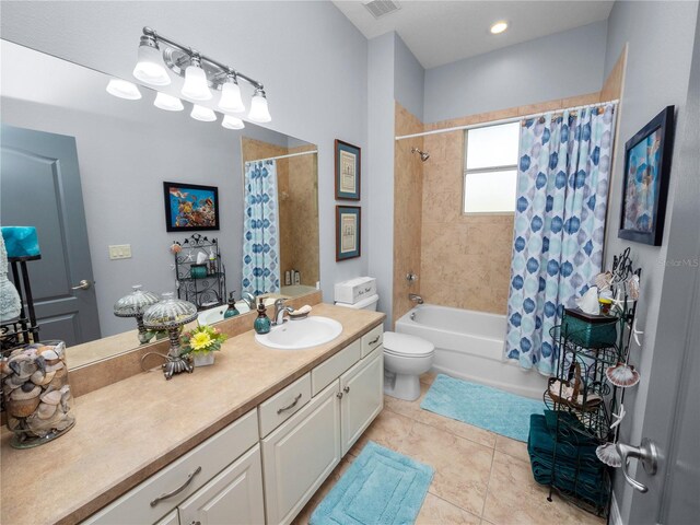 full bathroom featuring tile patterned floors, vanity, shower / bath combination with curtain, and toilet