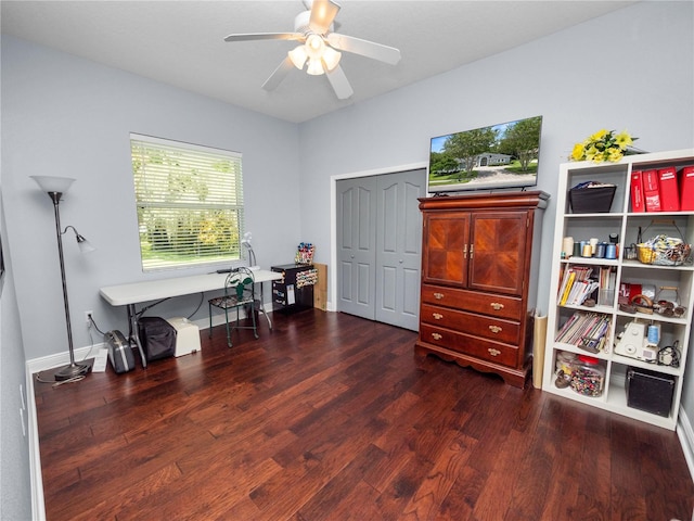 misc room featuring dark hardwood / wood-style floors and ceiling fan