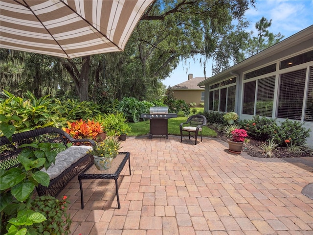 view of patio featuring a grill