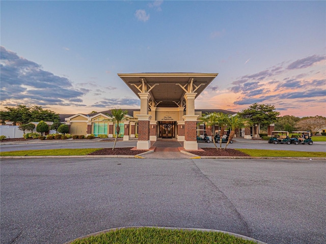 view of outdoor building at dusk