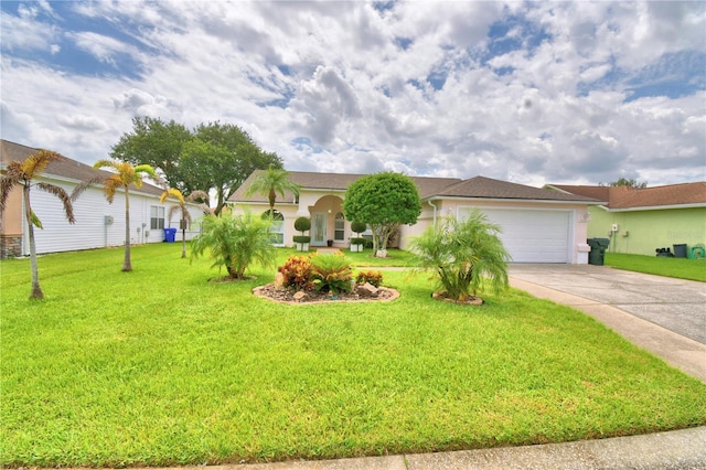 view of front of home with a garage and a front yard