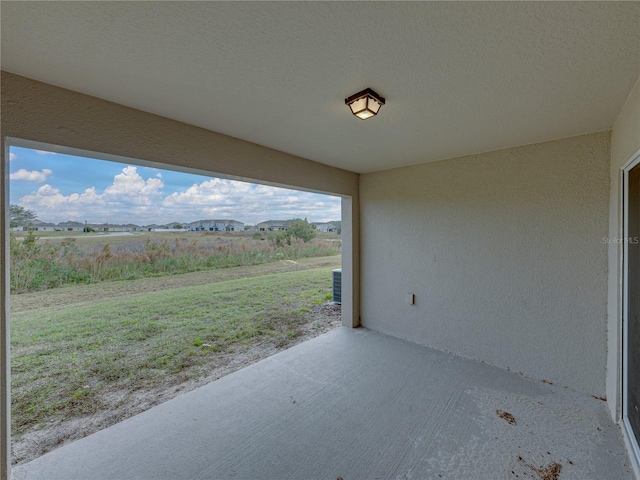 view of patio / terrace with a rural view and a mountain view