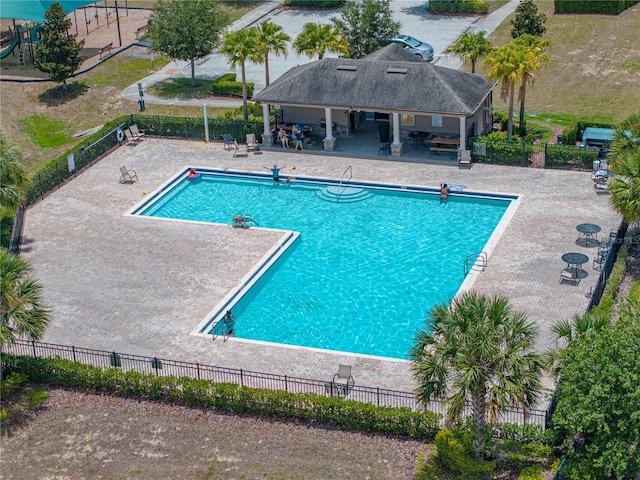 view of swimming pool featuring a patio area