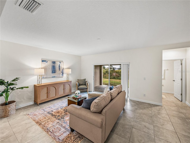 tiled living room with a textured ceiling