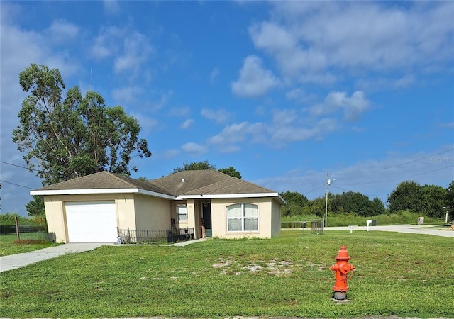 ranch-style house featuring a garage, concrete driveway, a front lawn, and stucco siding