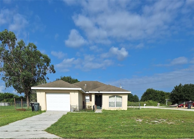 view of front of property featuring a garage and a front lawn