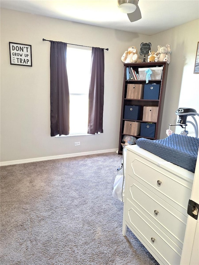 carpeted bedroom with baseboards