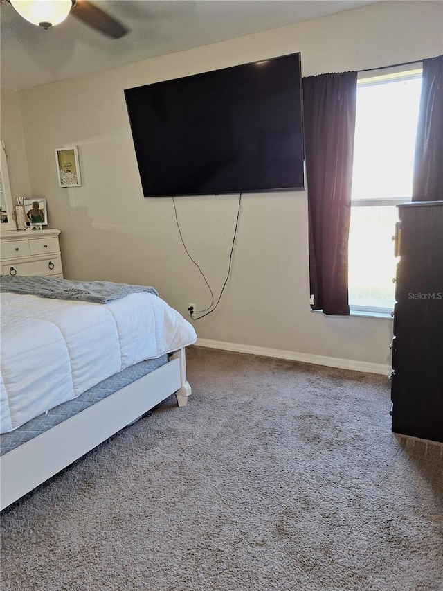 bedroom featuring carpet flooring, ceiling fan, and baseboards