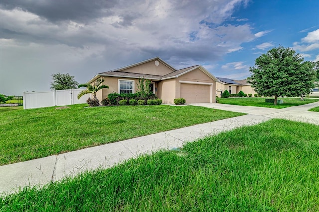 single story home featuring a garage and a front lawn