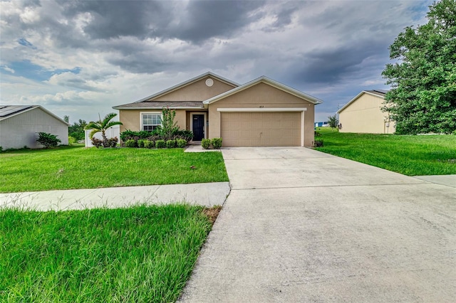 single story home featuring a garage and a front lawn