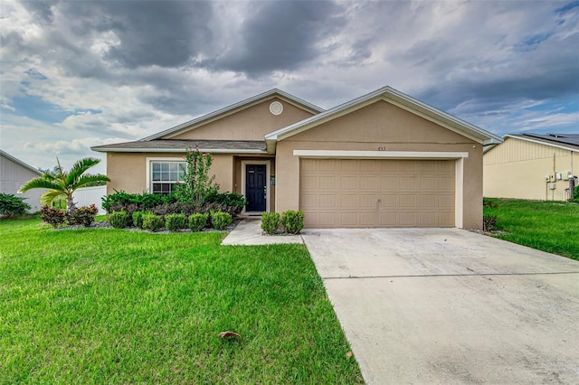 single story home featuring a garage and a front yard