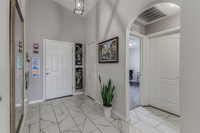 entryway featuring light tile patterned floors