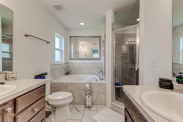 full bathroom with toilet, shower with separate bathtub, tile patterned flooring, and vanity