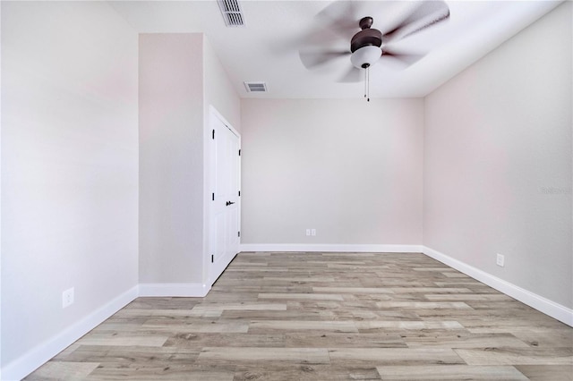 unfurnished room featuring ceiling fan and light hardwood / wood-style floors