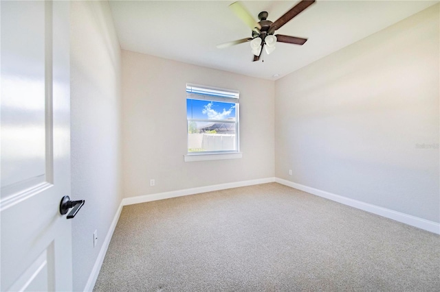 unfurnished room with carpet flooring and ceiling fan