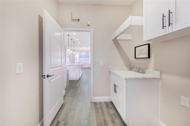 interior space featuring hardwood / wood-style floors and vanity